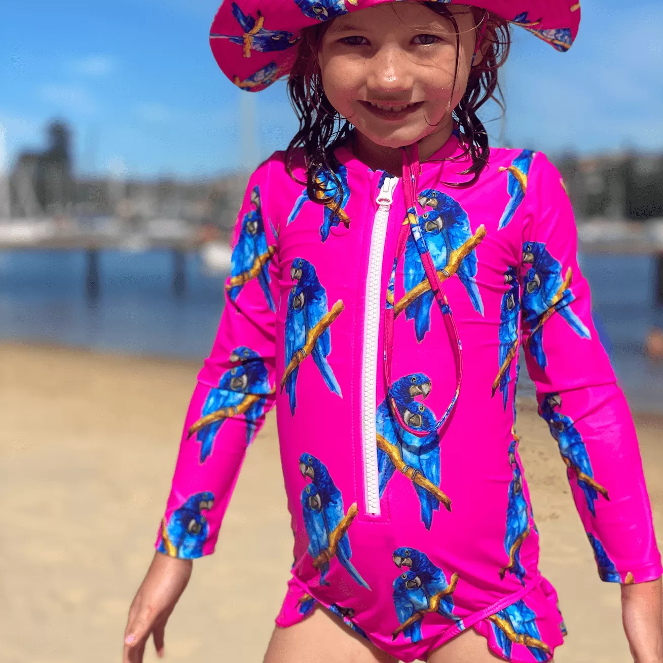 Fluro Macaw Girls Long Sleeve Zip Swimmers